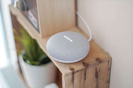 Round Grey Speaker On Brown Board thumbnail