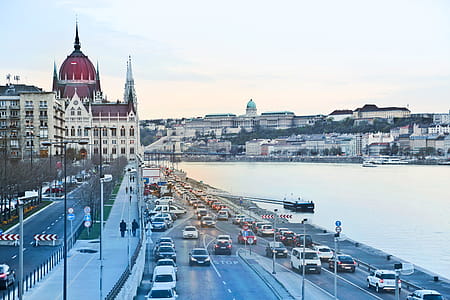 Side View Of Hungarian Parliament Building With Cars On Road in Budapest thumbnail