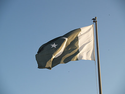 raised white and black flag during daytime thumbnail
