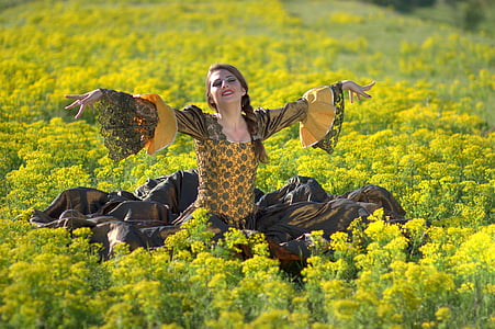 woman standing on green grass field thumbnail