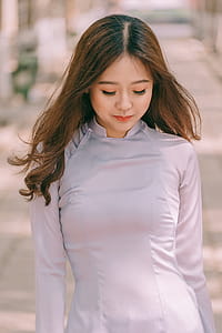 Woman Wearing White Long-sleeved Top thumbnail