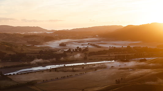 aerial view photography of river during sunset thumbnail