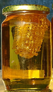 clear glass jar containing honey thumbnail