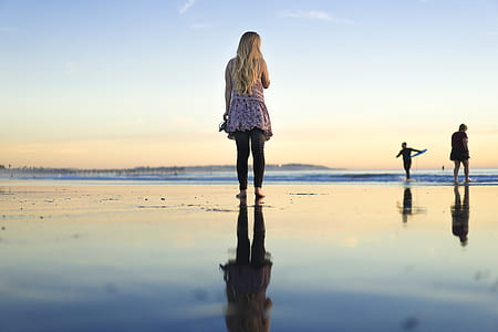 woman standing on body of water thumbnail
