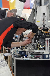 person repairing machine thumbnail
