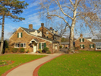 footpath leading to brown brick house thumbnail