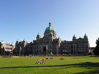 people on green grass field near dome building and trees thumbnail
