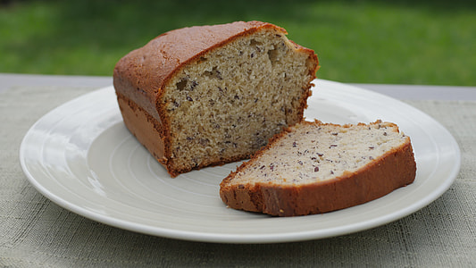 sliced banana cake on white plate thumbnail