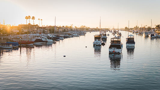 boats on body of water during sunset thumbnail