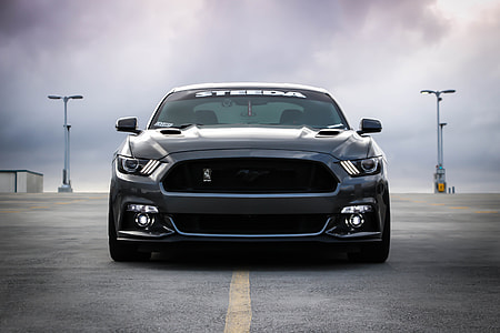 photo of gray Ford Mustang on road during daytime thumbnail
