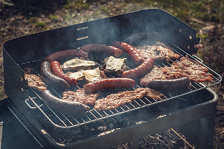 meats on top of charcoal grill thumbnail