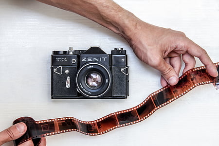 black and gray Minolta DSLR camera thumbnail