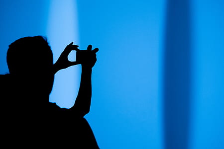 silhouette of woman taking photo thumbnail