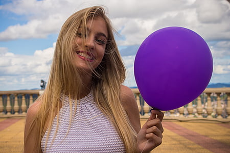 woman holding purple balloon thumbnail