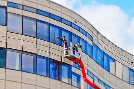man repairing glass building window thumbnail
