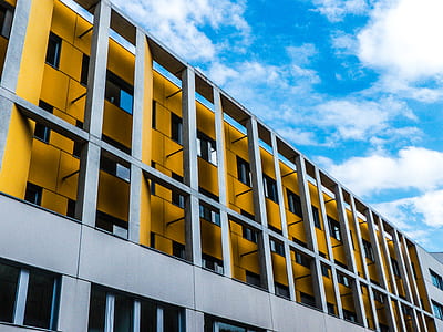 low angle photography of gray building at daytime thumbnail