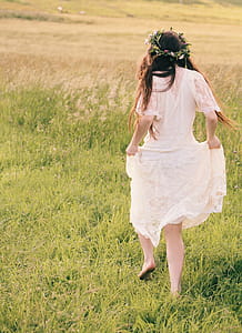Woman Wearing White Floral Dress thumbnail