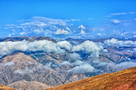 mountains covered in clouds thumbnail