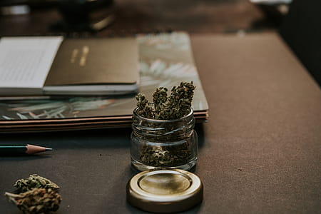 Close-Up Photo of Kush On Glass Container thumbnail