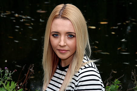 woman wearing black and white stripe shirt thumbnail