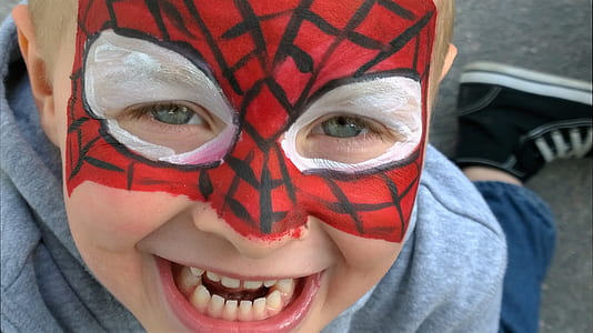 closeup photo of boy with Spider-Man face mask thumbnail