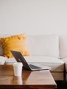 silver MacBook open near plastic cup thumbnail