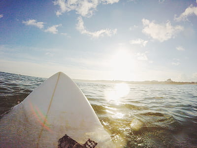 person riding surfboard on water thumbnail