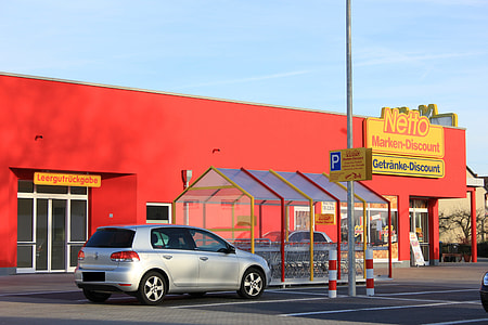 gray car parked near shopping carts thumbnail