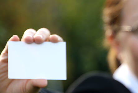 person holding white card thumbnail