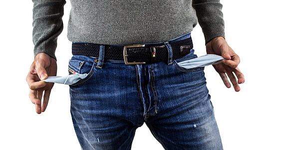 man wearing jeans with empty pockets thumbnail