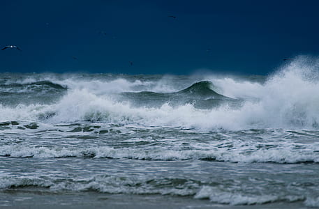 waves crashing on sand thumbnail