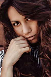 woman holding cheek taking selfie thumbnail