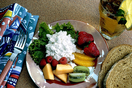 assorted sliced of fruits with white sauce thumbnail