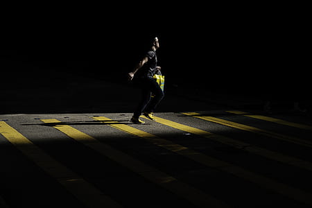 person running on yellow and gray pavement thumbnail