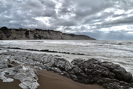 seashore beside mountain thumbnail