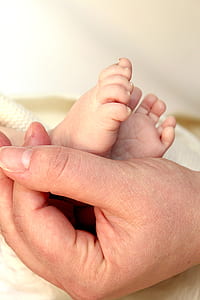 person touching baby's foot thumbnail