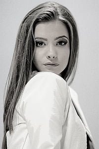 grayscale photo of girl wearing jacket thumbnail