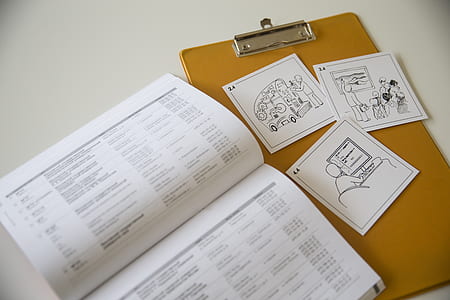 white papers on brown wooden board thumbnail
