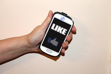 person holding white smartphone thumbnail