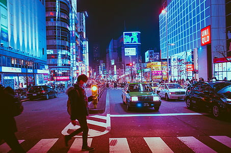 person walking on lane in busy streets thumbnail