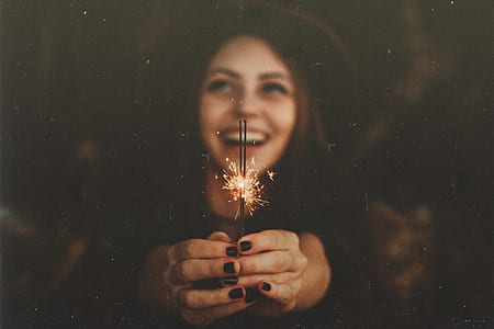 woman holding firecracker thumbnail