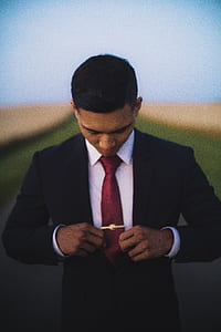man holding his necktie thumbnail