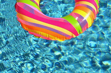 pink inflatable floater on water thumbnail