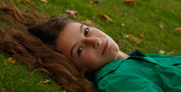 woman lying on grass thumbnail