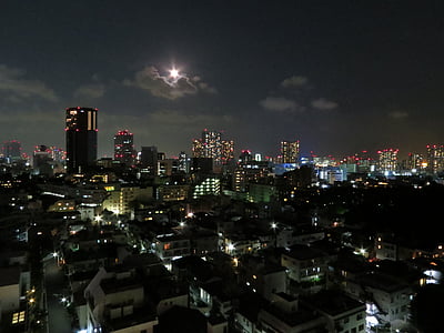 aerial photography of high-rise buildings at night thumbnail
