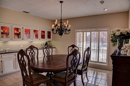 candelabra chandelier turned on above dining table set thumbnail