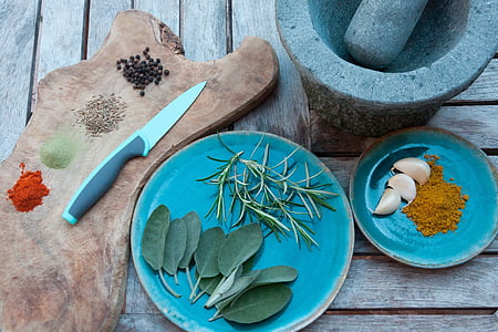 grey handle knife beside round blue ceramic plate thumbnail