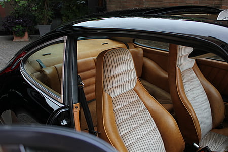 opened door with empty brown leather vehicle bucket seats thumbnail
