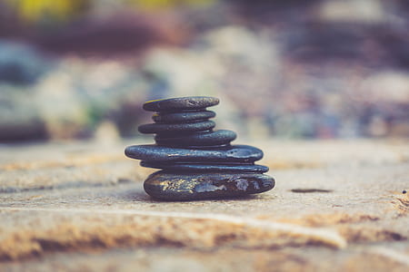 black stones on brown surface thumbnail