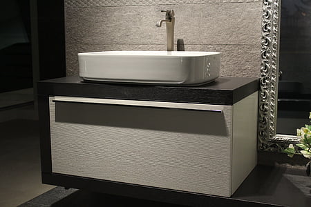 white ceramic sink with silver faucet thumbnail